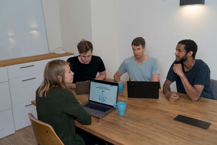 Employees discussing agentic AI systems